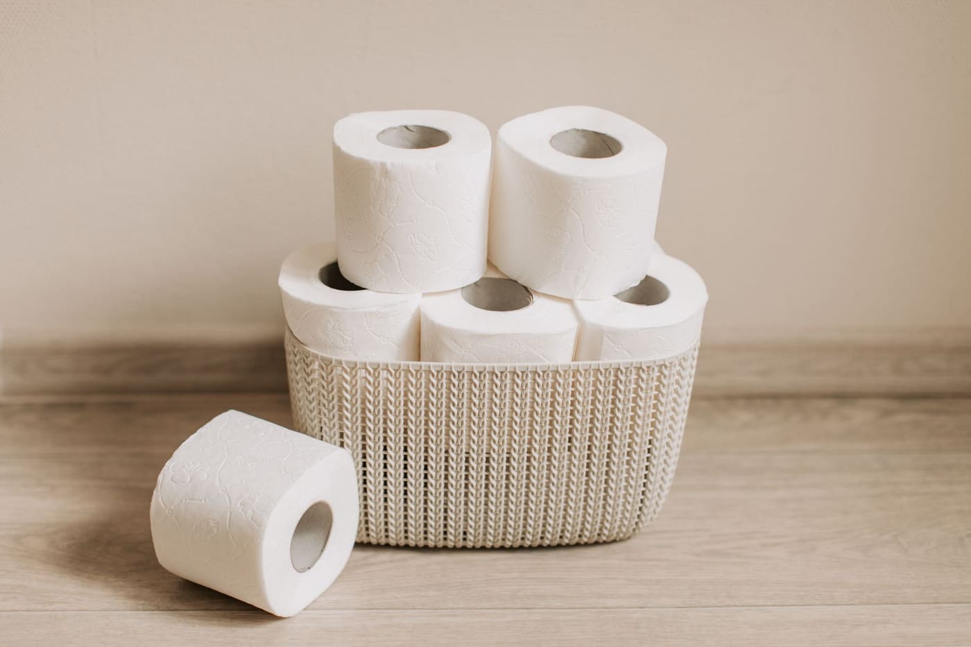 Basket of toilet paper rolls neatly arranged