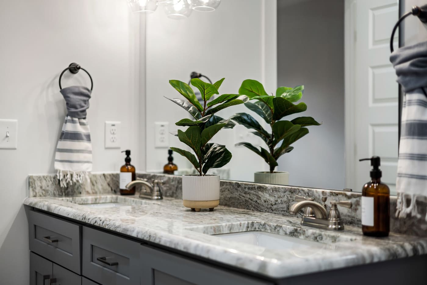 Bathroom with twin sinks and a granite counter