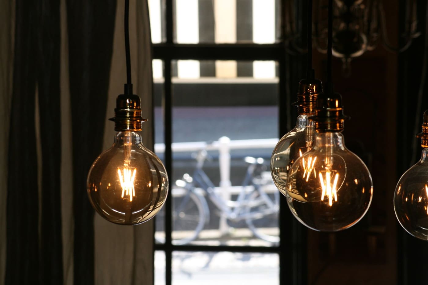 Close-up of vintage bulbs with warm glowing filaments